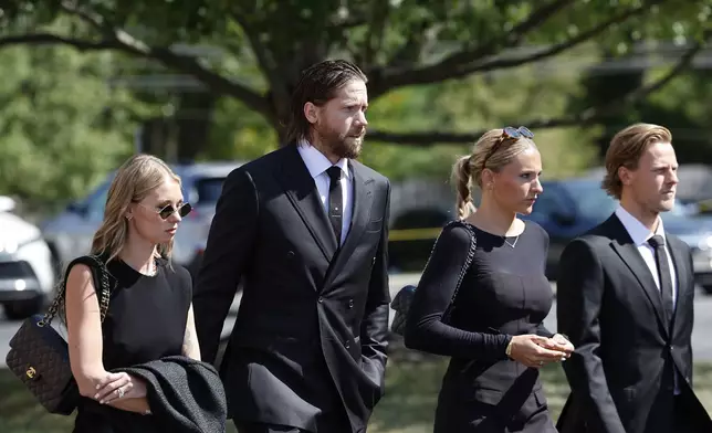 New Jersey Devils goaltender Jacob Markström, second left, arrives for the funeral services for Columbus Blue Jackets hockey player John Gaudreau and Matthew Gaudreau at Saint Mary Magdalen Church in Media, Pa., Monday, Sept. 9, 2024. (Yong Kim/The Philadelphia Inquirer via AP)