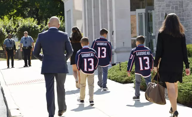 Young attendees wear Johnny Gaudreau's Columbus Blue Jackets jersey to the funeral services for Johnny Gaudreau and Matthew Gaudreau at Saint Mary Magdalen Church in Media, Pa., Monday, Sept. 9, 2024. (Yong Kim/The Philadelphia Inquirer via AP)