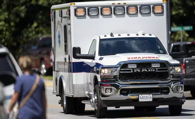 An ambulance departs Apalachee High School after a shooting at the school, Wednesday, Sept. 4, 2024, in Winder, Ga. (AP Photo/Mike Stewart)