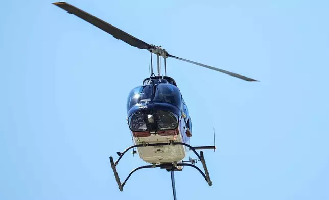 A medical helicopter flies out of Apalachee High School after a shooting at the school Wednesday, Sept. 4, 2024, in Winder, Ga. (AP Photo/Mike Stewart)