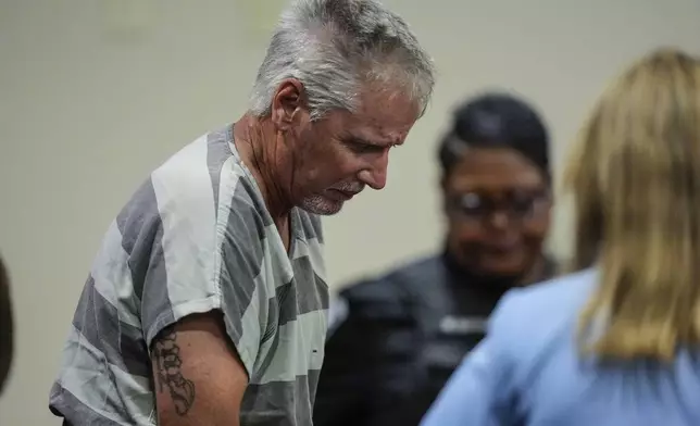 Colin Gray, 54, the father of Apalachee High School shooter Colt Gray, 14, enters the Barrow County courthouse for his first appearance, on Friday, Sept. 6, 2024, in Winder, Ga. (AP Photo/Brynn Anderson, Pool)