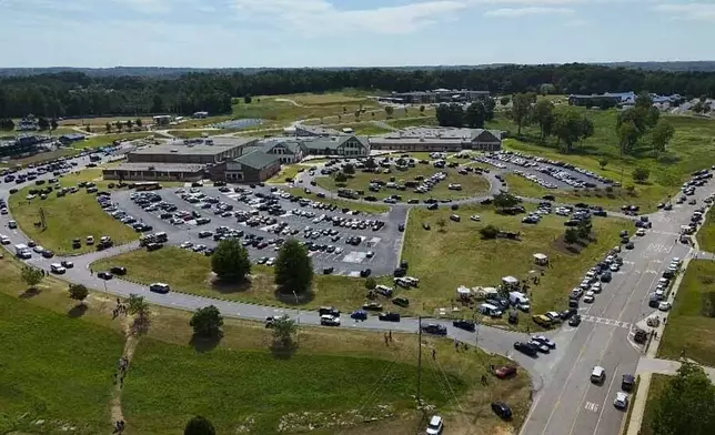 People leave Apalachee High School, Wednesday, Sept. 4, 2024, in Winder, Ga. (AP Photo/Mike Stewart)