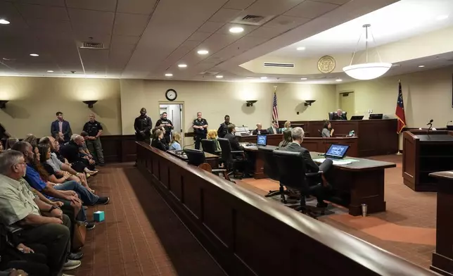 Colt Gray, left, sits in the Barrow County courthouse during his first appearance for the Wednesday shooting at Apalachee High School, Friday, Sept. 6, 2024, in Winder, Ga. (AP Photo/Brynn Anderson, Pool)