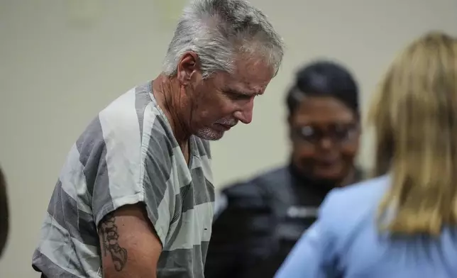 Colin Gray, 54, the father of Apalachee High School shooter Colt Gray, 14, enters the Barrow County courthouse for his first appearance, on Friday, Sept. 6, 2024, in Winder, Ga. (AP Photo/Brynn Anderson)