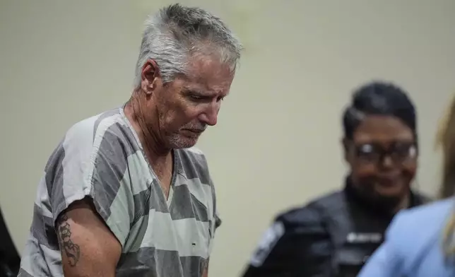 Colin Gray, 54, the father of Apalachee High School shooter Colt Gray, 14, enters the Barrow County courthouse for his first appearance, on Friday, Sept. 6, 2024, in Winder, Ga. (AP Photo/Brynn Anderson)