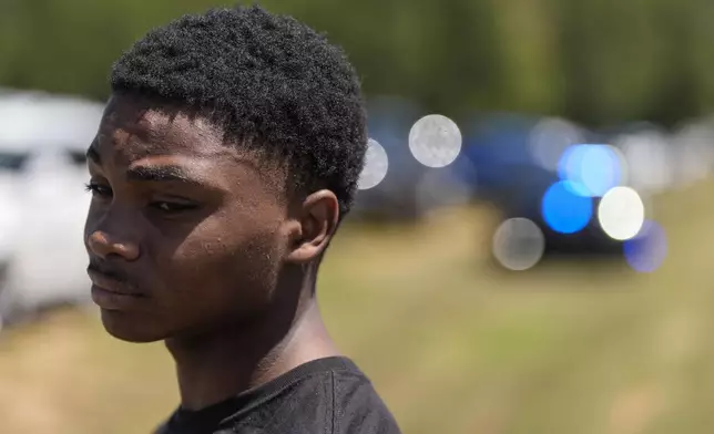 Ninth grader Jacob Fokuo describes the shooting at Apalachee High School, Wednesday, Sept. 4, 2024, in Winder, Ga. A shooting at the Georgia high school Wednesday caused an unknown number of injuries and a suspect was arrested in a chaotic scene. (AP Photo/Mike Stewart)