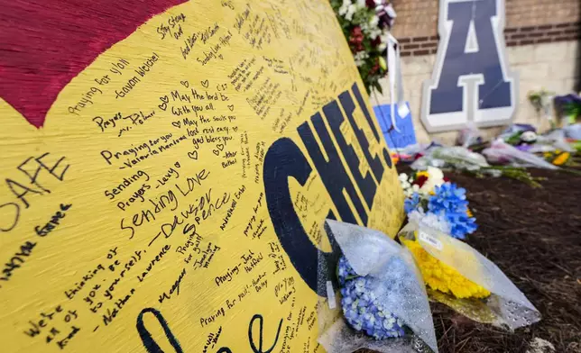 A memorial is seen at Apalachee High School after the Wednesday school shooting, Saturday, Sept. 7, 2024, in Winder, Ga. (AP Photo/Mike Stewart)