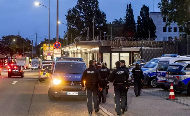 German police officers gather at the border between Germany and France in Kehl, Germany, Monday, Sept. 16, 2024 as Germany controls all his borders from Monday on. (AP Photo/Michael Probst)