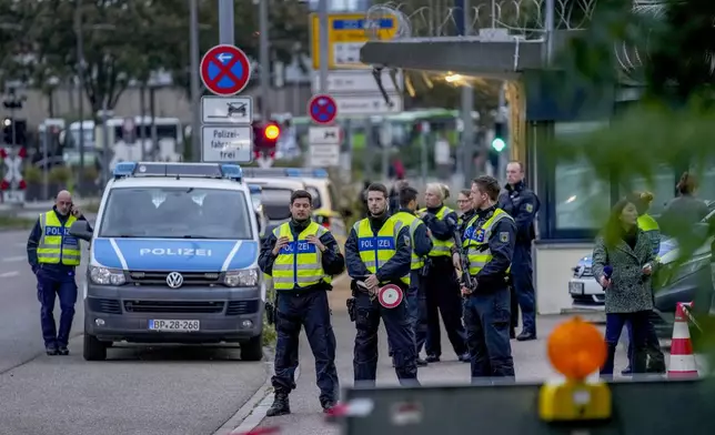 German police officers gather at the border between Germany and France in Kehl, Germany, Monday, Sept. 16, 2024 as Germany controls all his borders from Monday on. (AP Photo/Michael Probst)