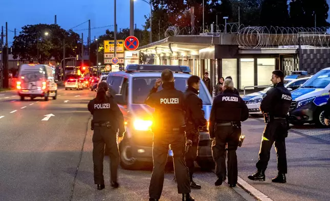 German police officers stand at the border between Germany and France in Kehl, Germany, Monday, Sept. 16, 2024 as Germany controls all his borders from Monday on. (AP Photo/Michael Probst)