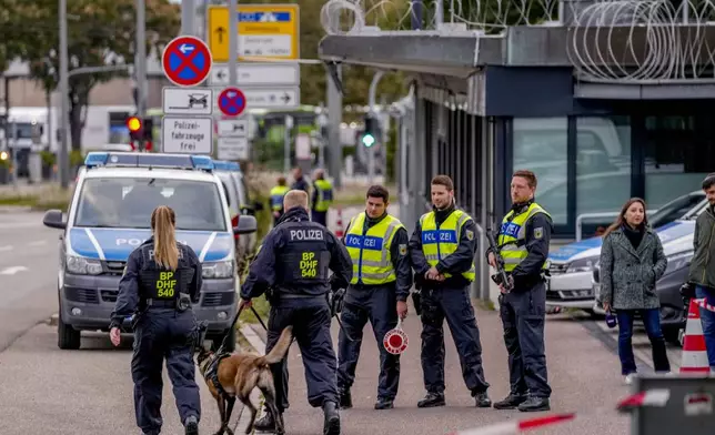 German police officers gather at the border between Germany and France in Kehl, Germany, Monday, Sept. 16, 2024 ad Germany controls all his borders from Monday on. (AP Photo/Michael Probst)