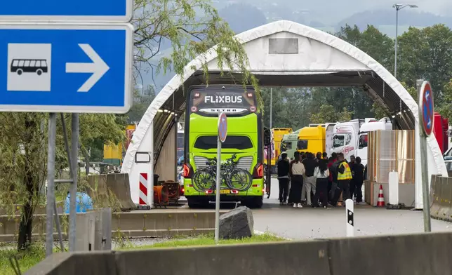 A coach coming from Austria is checked at the border checkpoint on the A93 highway near Kiefersfelden on the German side Monday, Sept. 16, 2024. (Peter Kneffel/dpa via AP)