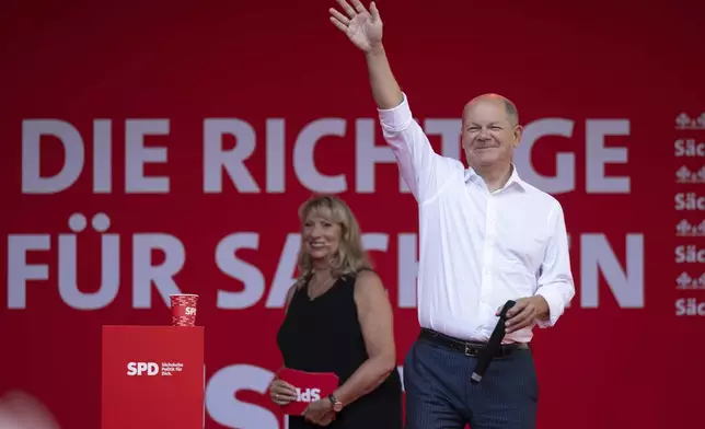 Petra K'pping, Saxony's Minister of Social Affairs and SPD lead candidate for the 2024 state election in Saxony, welcomes German Chancellor Olaf Scholz at the SPD's election campaign finale, in Chemnitz, Germany, Friday Aug. 30, 2024. (Hendrik Schmidt/dpa via AP)