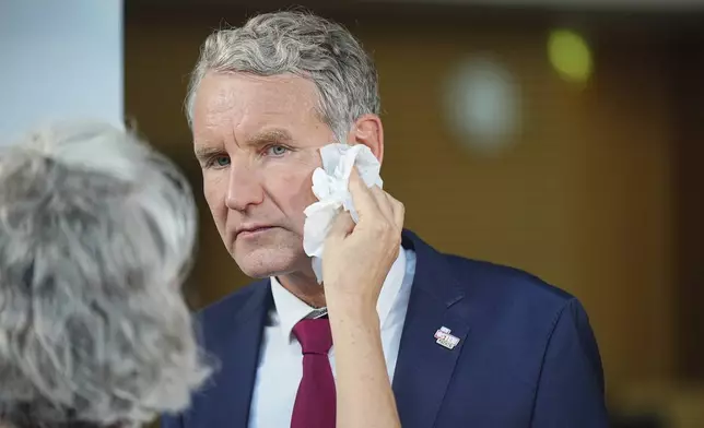 Bjoern Hoecke, top candidate in Thuringia of the far-right Alternative for Germany, prepares for an interview during the state election for Thuringia, in Erfurt, Germany, Sunday, Sept. 1, 2024. (Michael Kappeler/dpa via AP)