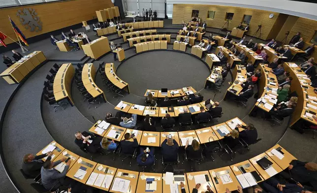 Members of parliament attend the constituent session of the Thuringian state parliament in Erfurt, Germany Saturday, Sept. 28, 2024. (Martin Schutt/dpa/dpa via AP)