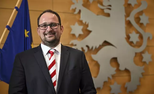 Christian Democratic Union's Thadäus König, as the new state parliament president, poses during the constituent session of the Thuringian state parliament in Erfurt, Germany Saturday, Sept. 28, 2024. (Martin Schutt/dpa via AP)