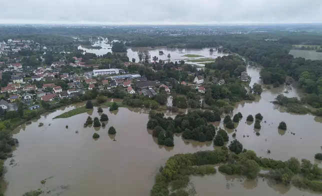 A view of the southern Görlitz district of Weinhübel and the Neiße river overflowing its banks, in Germany, Monday, Sept. 16, 2024. (Paul Glaser/dpa via AP)