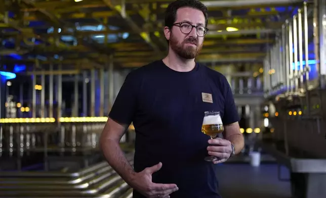 Head Brewmaster Tobias Zollo gestures during an interview with the Associated Press at the Weihenstephan brewery in Freising, Germany, Friday, Sept. 20, 2024. (AP Photo/Matthias Schrader)