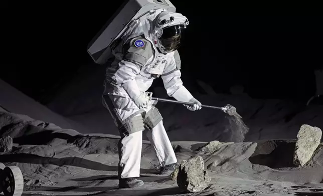 Astronauts demonstrate their training in lunar surface simulating conditions for future moon missions, like the Artemis lunar exploration program led by NASA, at the opening of the new LUNA facility at the European Astronaut Center in Cologne, Germany, Wednesday, Sept. 25, 2024. (AP Photo/Martin Meissner)
