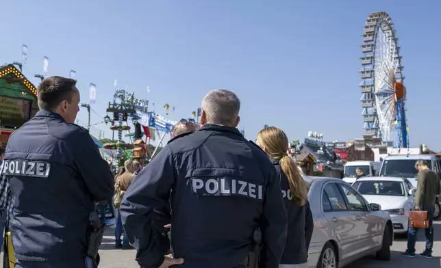 Police officer patrol, during a press tour at the Oktoberfest, in Munich, Germany, Thursday, Sept. 19, 2024. (Lennart Preiss/dpa via AP)