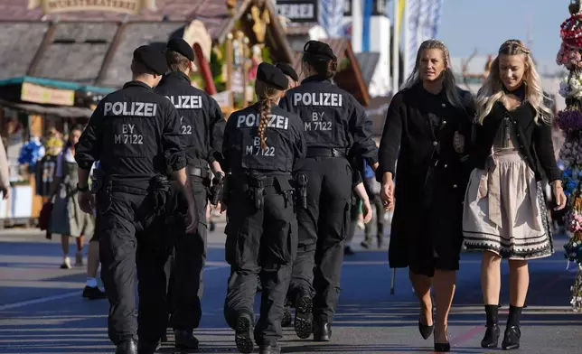 Police patrols before the start of the 189th 'Oktoberfest' beer festival in Munich, Germany, Saturday, Sept. 21, 2024. (AP Photo/Matthias Schrader)