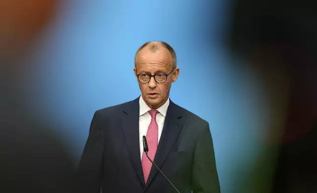 German opposition leader and Christian Democratic Union party chairman Friedrich Merz talks to the media at a joint news conference with Markus Soeder, Christian Social Union party leader and state governor of Bavaria, in Berlin, Germany, Tuesday, Sept. 17, 2024. (AP Photo/Markus Schreiber)