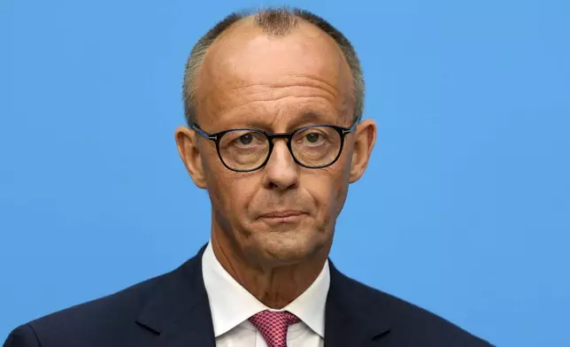 German opposition leader and Christian Democratic Union party chairman Friedrich Merz watches the media at a joint news conference with Markus Soeder, Christian Social Union party leader and state governor of Bavaria, in Berlin, Germany, Tuesday, Sept. 17, 2024. (AP Photo/Markus Schreiber)