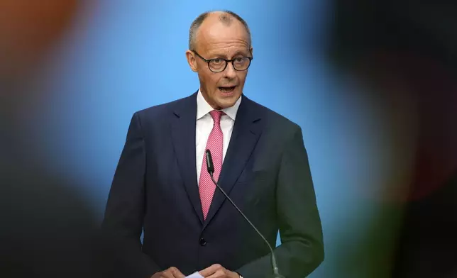 German opposition leader and Christian Democratic Union party chairman Friedrich Merz talks to the media at a joint news conference with Markus Soeder, Christian Social Union party leader and state governor of Bavaria, in Berlin, Germany, Tuesday, Sept. 17, 2024. (AP Photo/Markus Schreiber)