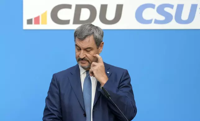 Markus Soeder, Christian Social Union party leader and state governor of Bavaria is pictured at a joint news conference with German opposition leader and Christian Democratic Union party chairman Friedrich Merz, in Berlin, Germany, Tuesday, Sept. 17, 2024. (AP Photo/Markus Schreiber)