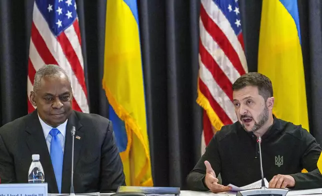 U.S. Defense Secretary Lloyd Austin, left, listens to Ukraine's President Volodymyr Zelenskyy during a meeting also with German's Defense Minister Boris Pistorius and Chairman of the Joint Chiefs of Staff Air Force of the U.S. Gen. CQ Brown at Ramstein Air Base in Ramstein-Miesenbach, Germany, Friday, Sept. 6, 2024. (Andreas Arnold/dpa via AP)