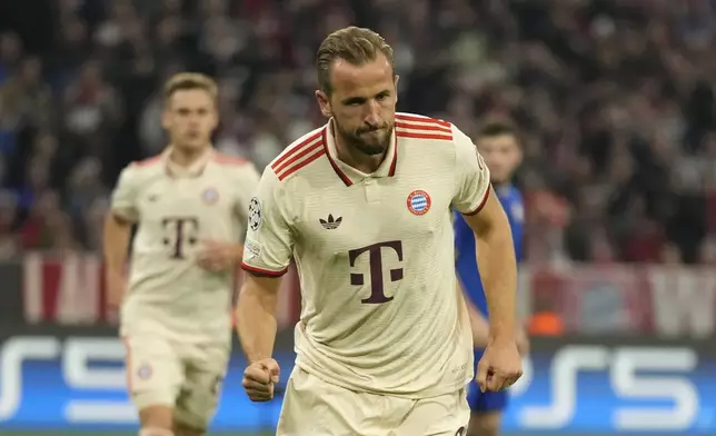 Bayern's Harry Kane celebrates after scoring the opening goal from the penalty sport during the Champions League opening phase soccer match between Bayern Munich and GNK Dinamo at the Allianz Arena in Munich, Germany Tuesday, Sept. 17, 2024. (AP Photo/Matthias Schrader)