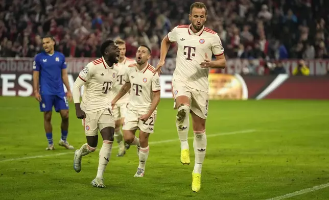 Bayern's Harry Kane, right, celebrates after scoring his sides 5th goal during the Champions League opening phase soccer match between Bayern Munich and GNK Dinamo at the Allianz Arena in Munich, Germany Tuesday, Sept. 17, 2024. (AP Photo/Matthias Schrader)