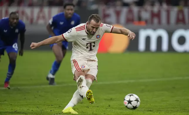 Bayern's Harry Kane scores his sides 6th goal and his third of the game for a hat-trick, from the penalty spot during the Champions League opening phase soccer match between Bayern Munich and GNK Dinamo at the Allianz Arena in Munich, Germany Tuesday, Sept. 17, 2024. (AP Photo/Matthias Schrader)