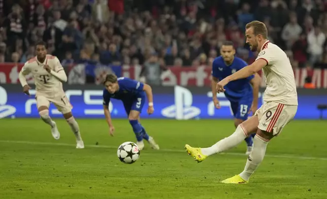 Bayern's Harry Kane scores the opening goal from the penalty sport during the Champions League opening phase soccer match between Bayern Munich and GNK Dinamo at the Allianz Arena in Munich, Germany Tuesday, Sept. 17, 2024. (AP Photo/Matthias Schrader)