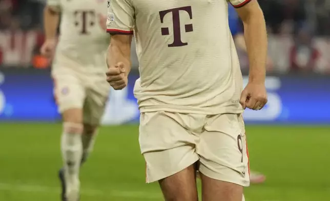 Bayern's Harry Kane celebrates after scoring the opening goal from the penalty sport during the Champions League opening phase soccer match between Bayern Munich and GNK Dinamo at the Allianz Arena in Munich, Germany Tuesday, Sept. 17, 2024. (AP Photo/Matthias Schrader)