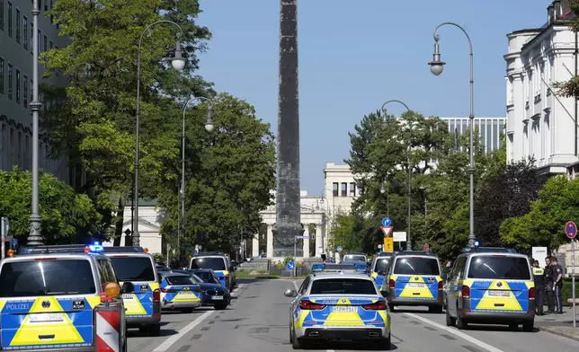 Police officers block a street after police fired shots at a suspicious person near the Israeli Consulate and a museum on the city's Nazi-era history in Munich, Germany, Thursday, Sept. 5, 2024. (AP Photo/Matthias Schrader)