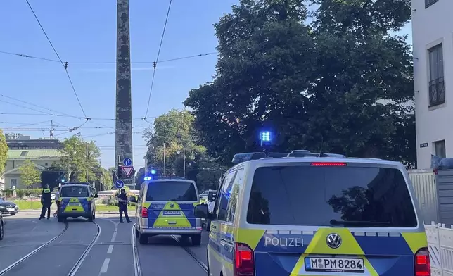 Police vehicles parked in Munich near the Nazi Documentation Center and the Israeli Consulate General in Munich, Germany, Thursday, Sept. 5, 2024. (Simon Sachseder/dpa via AP)