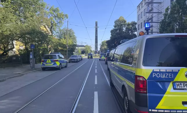 Police vehicles parked in Munich near the Nazi Documentation Center and the Israeli Consulate General in Munich, Germany, Thursday, Sept. 5, 2024. (Simon Sachseder/dpa via AP)