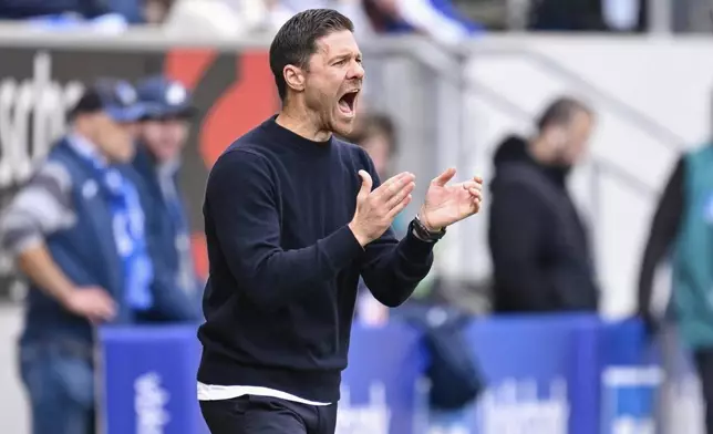 Leverkusen coach Xabi Alonso gives instructions during a match between TSG Hoffenheim and Bayer 04 Leverkusen on Saturday, Sept. 14, 2024 in Sinsheim, Germany. (Uwe Anspach/dpa via AP)