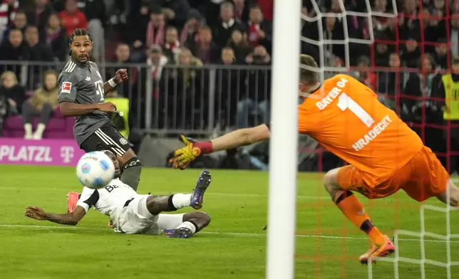 Bayern's Serge Gnabry attempts a score during the Bundesliga soccer match between Bayern Munich and Leverkusen at the Allianz Arena in Munich, Germany, Saturday, Sept. 28, 2024. (AP Photo/Matthias Schrader)