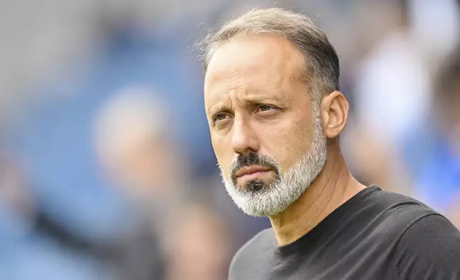 Hoffenheim coach Pellegrino Matarazzo stands in the stadium before a match between TSG Hoffenheim and Bayer 04 Leverkusen on Saturday, Sept. 14, 2024 in Sinsheim, Germany. (Uwe Anspach/dpa via AP)