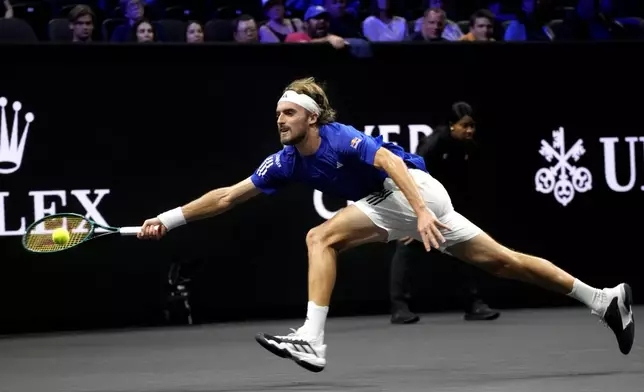 Team Europe's Stefanos Tsitsipas returns a ball during his singles tennis match against team World's Thanasi Kokkinakis on the first day of the Laver Cup tennis tournament at the Uber arena in Berlin, Germany, Friday, Sept. 20, 2024. (AP Photo/Ebrahim Noroozi)