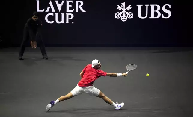 Team World's Francisco Cerundolo returns during his singles tennis match against team Europe's Casper Ruud on the first day of the Laver Cup tennis tournament at the Uber arena in Berlin, Germany, Friday, Sept. 20, 2024. (AP Photo/Ebrahim Noroozi)