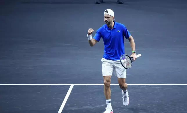 Team Europe's Grigor Dimitrov reacts during his singles tennis match against team World's Alejandro Tabilo on the first day of the Laver Cup tennis tournament at the Uber arena in Berlin, Germany, Friday, Sept. 20, 2024. (AP Photo/Ebrahim Noroozi)