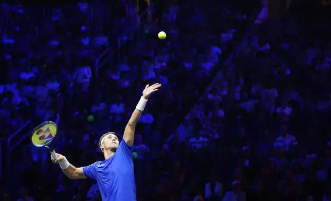 Team Europe's Casper Ruud serves to team World's Francisco Cerundolo during his singles tennis match on the first day of the Laver Cup tennis tournament at the Uber arena in Berlin, Germany, Friday, Sept. 20, 2024. (AP Photo/Ebrahim Noroozi)