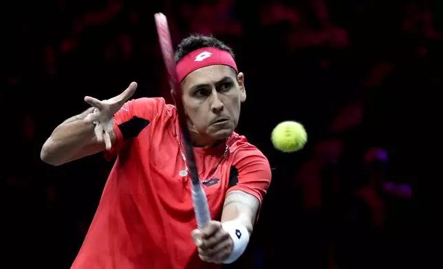 Team World's Alejandro Tabilo returns the ball during his singles tennis match against team Europe's Grigor Dimitrov on the first day of the Laver Cup tennis tournament at the Uber arena in Berlin, Germany, Friday, Sept. 20, 2024. (AP Photo/Ebrahim Noroozi)