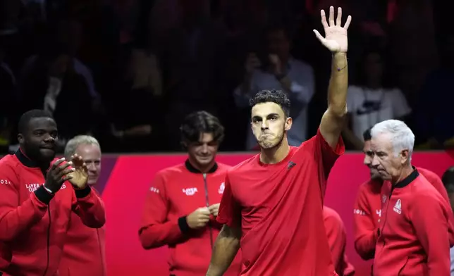 Team World's Francisco Cerundolo celebrates after winning against team Europe's Casper Ruud on the first day of the Laver Cup tennis tournament at the Uber arena in Berlin, Germany, Friday, Sept. 20, 2024. (AP Photo/Ebrahim Noroozi)