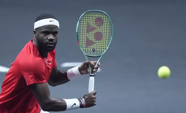 Team World's Frances Tiafoe returns to Team Europe's Daniil Medvedev on the second day of the Laver Cup tennis tournament at the Uber arena in Berlin, Germany, Saturday, Sept. 21, 2024. (AP Photo/Ebrahim Noroozi)