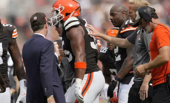 Cleveland Browns' Myles Garrett is helped off the field after an injury in the second half of an NFL football game against the New York Giants, Sunday, Sept. 22, 2024, in Cleveland. (AP Photo/Sue Ogrocki)