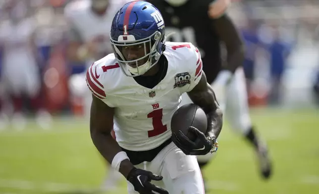 New York Giants wide receiver Malik Nabers (1) runs against the Cleveland Browns during the first half of an NFL football game, Sunday, Sept. 22, 2024 in Cleveland. (AP Photo/Sue Ogrocki)